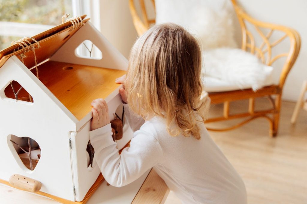 girl playing with a wooden box